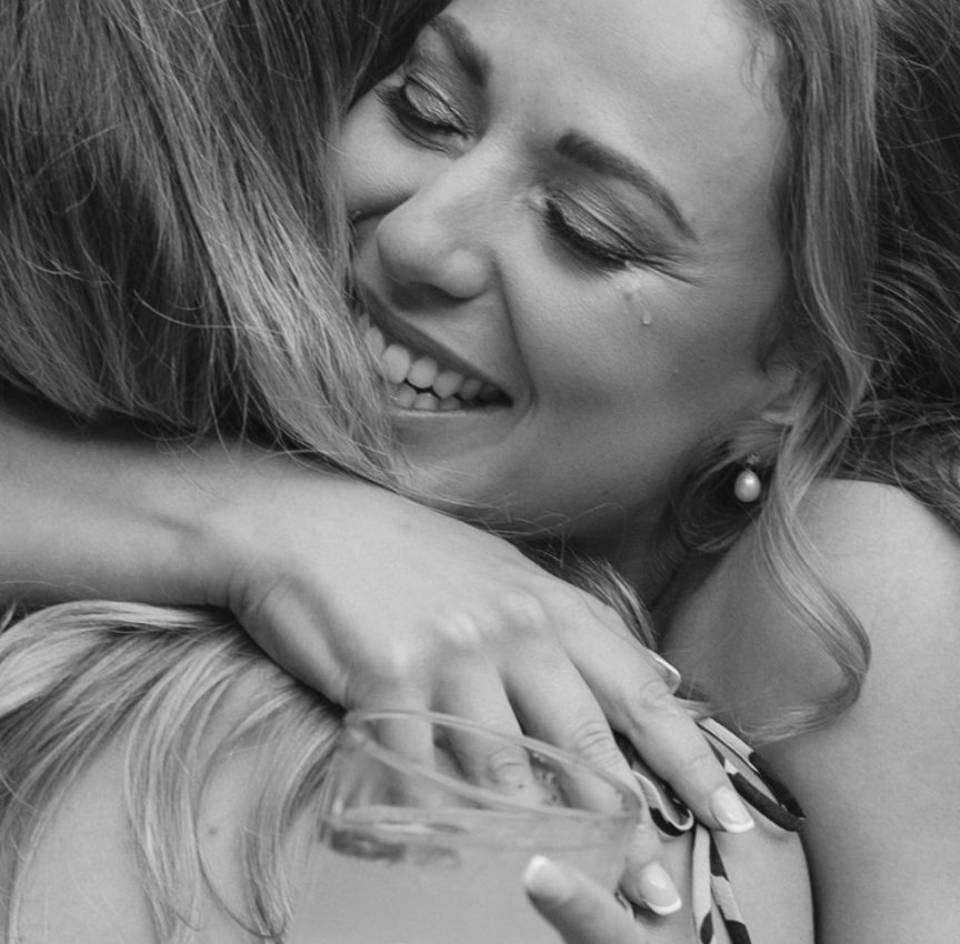 A series of black and white close-up shots showing intimate moments and joyful expressions.