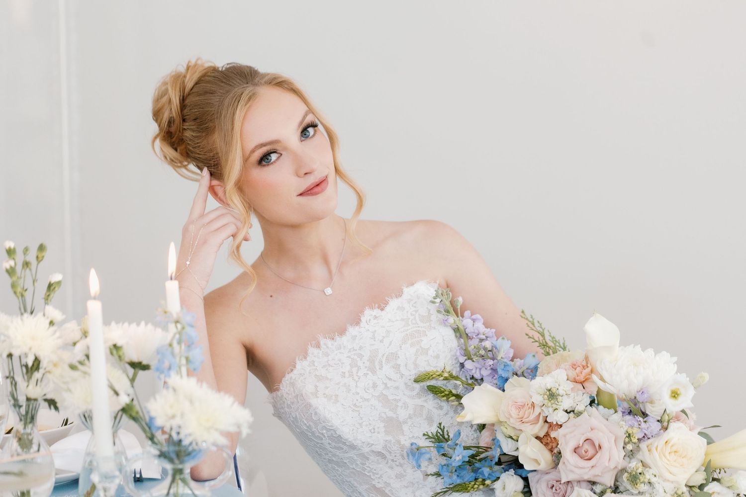 a beautiful bride with her bouquet in oklahoma city, with her makeup done for her wedding day oklahoma city okc best makeup artist