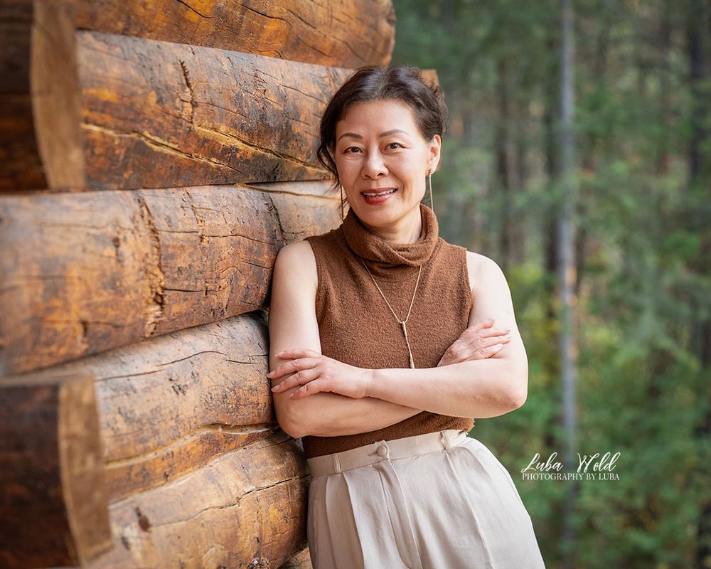outdoor personal branding portrait of Asian woman in brown top by Spokane headshot photographer in Post Falls Luba Wold