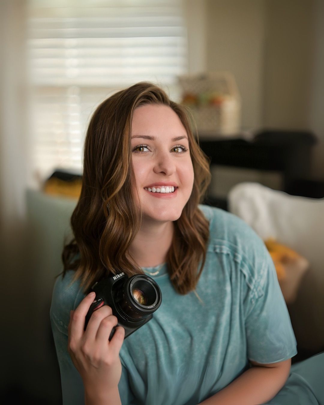 Portrait of Anna Wade, professional portrait photographer in Jasper, Alabama, capturing candid moments during a photo session.