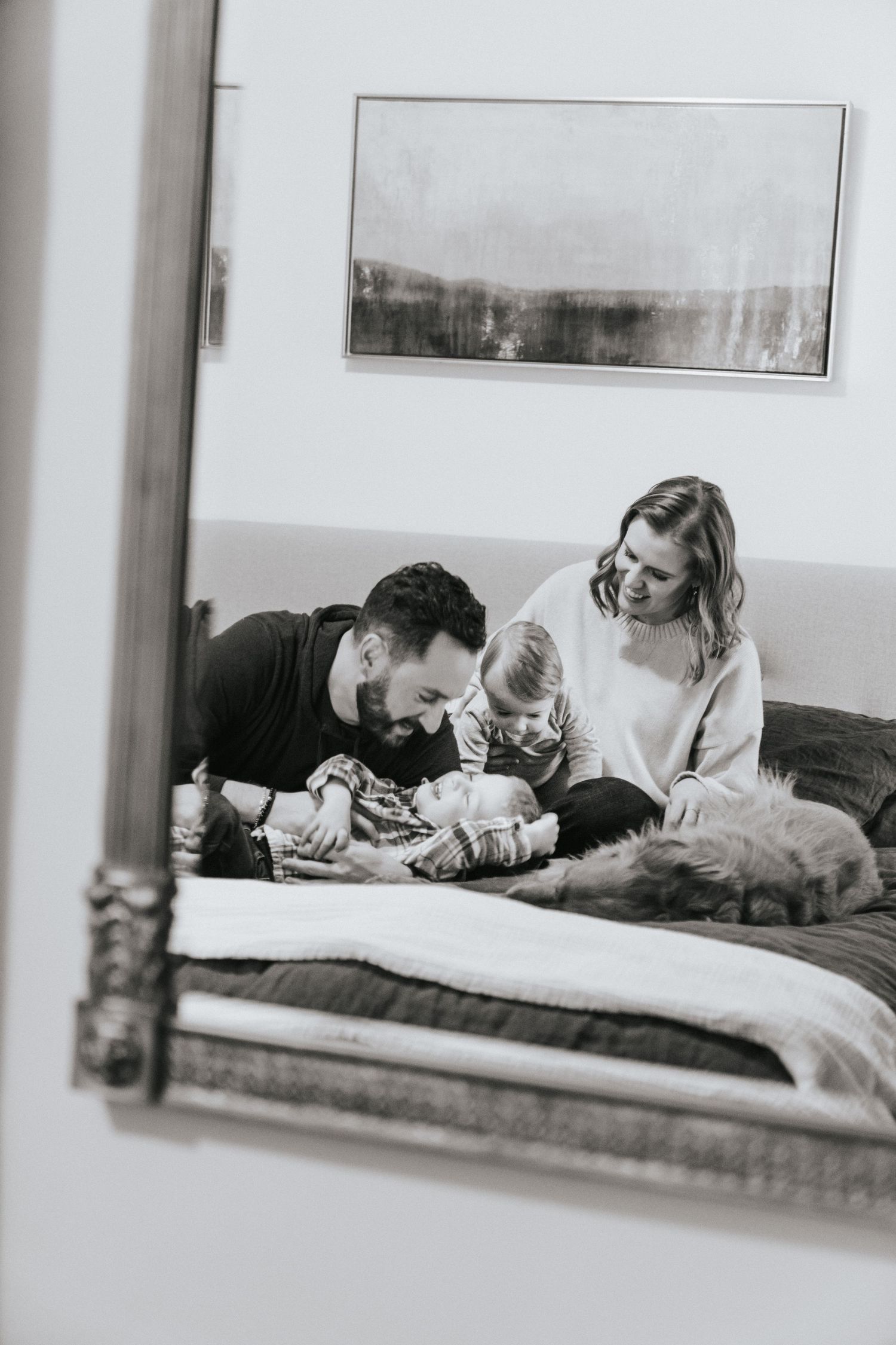 Black and white photo series showing family members relaxing together on a couch in casual, candid moments.