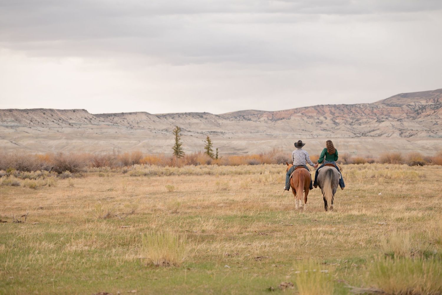 A stunning cowboy horseback western engagement session in the mountains of Wyoming.
