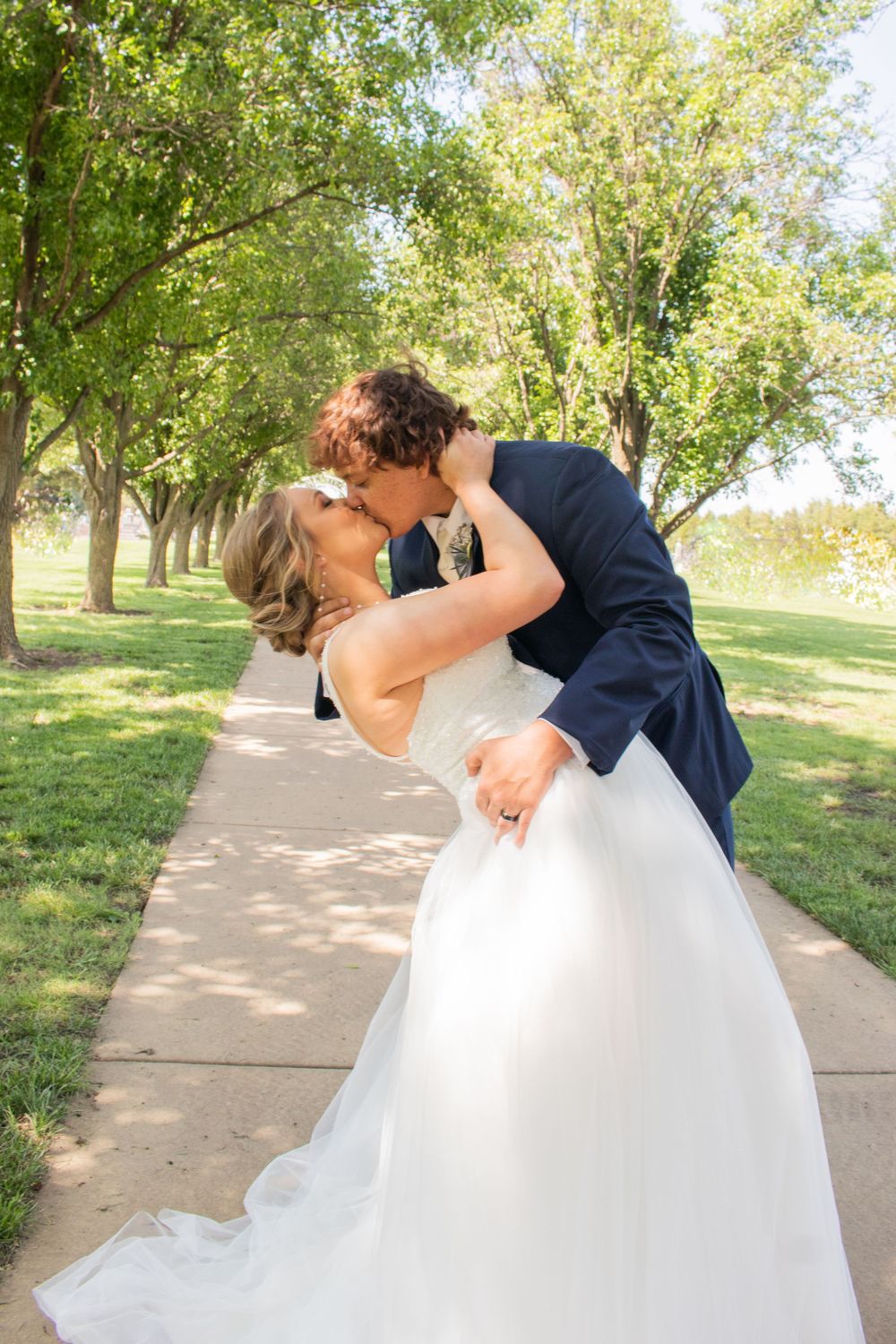 first kiss just married wedding portraits