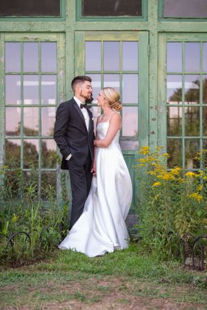 A romantic scene against a vintage green window backdrop with yellow wildflowers.