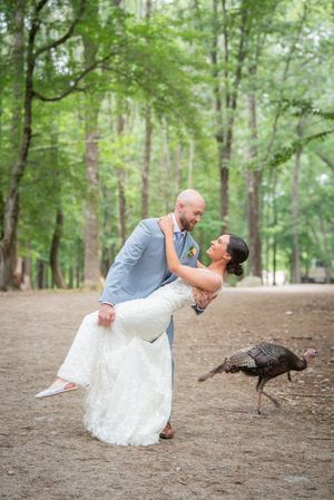 Whimsical forest wedding portraits with wild turkeys wandering through the scene.