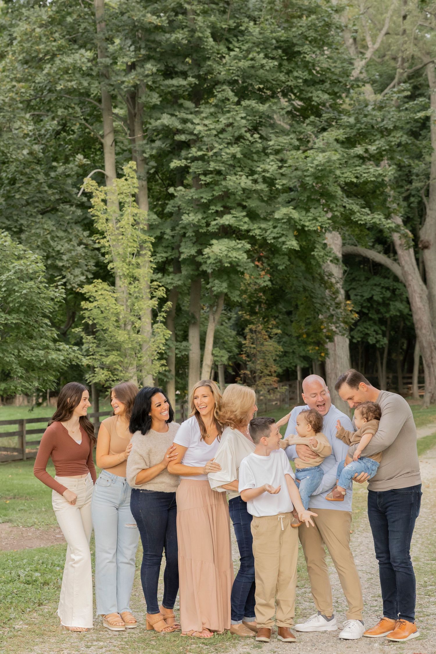 large family laughing at each other at cranberry lake park in Oakland county