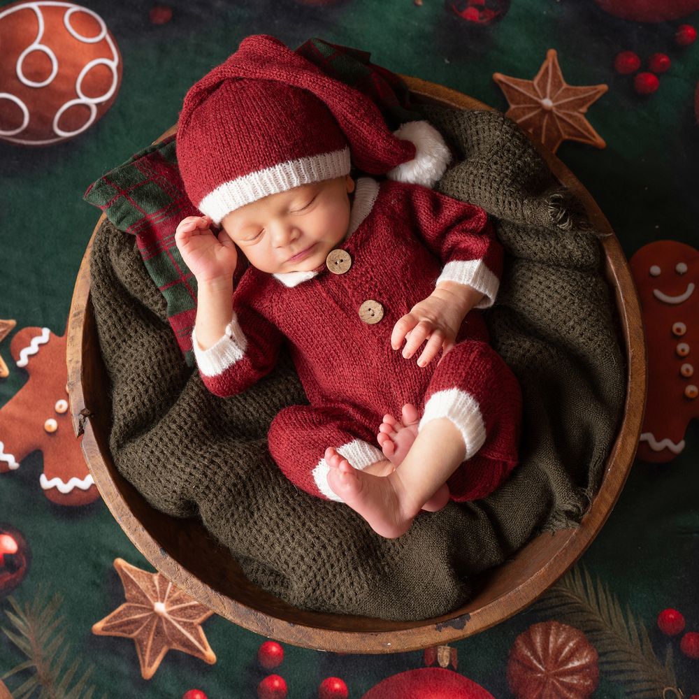 Newborn is a Santa outfit. Cherished Moments Photography
