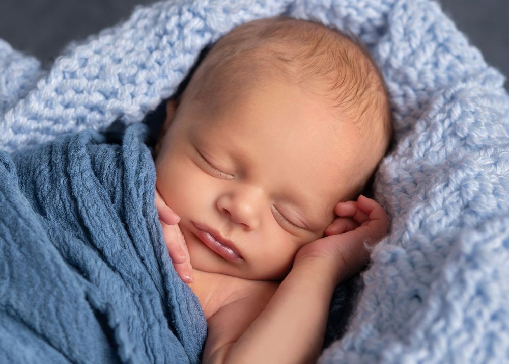 Newborn portraits of a sweet little boy in Minnesota portrait studio.