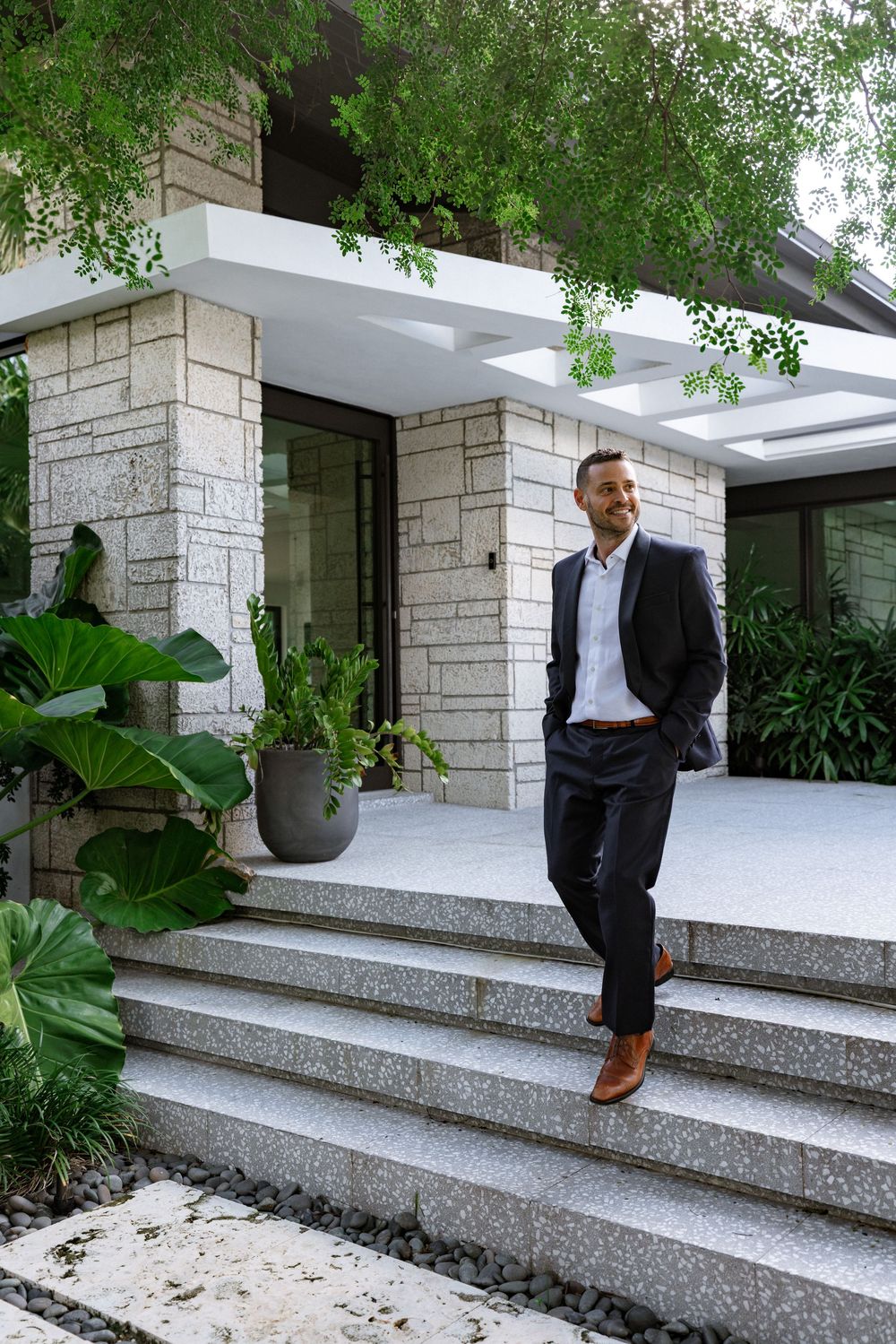 Executive personal branding photography in South Florida featuring a business leader in a luxury architectural setting.