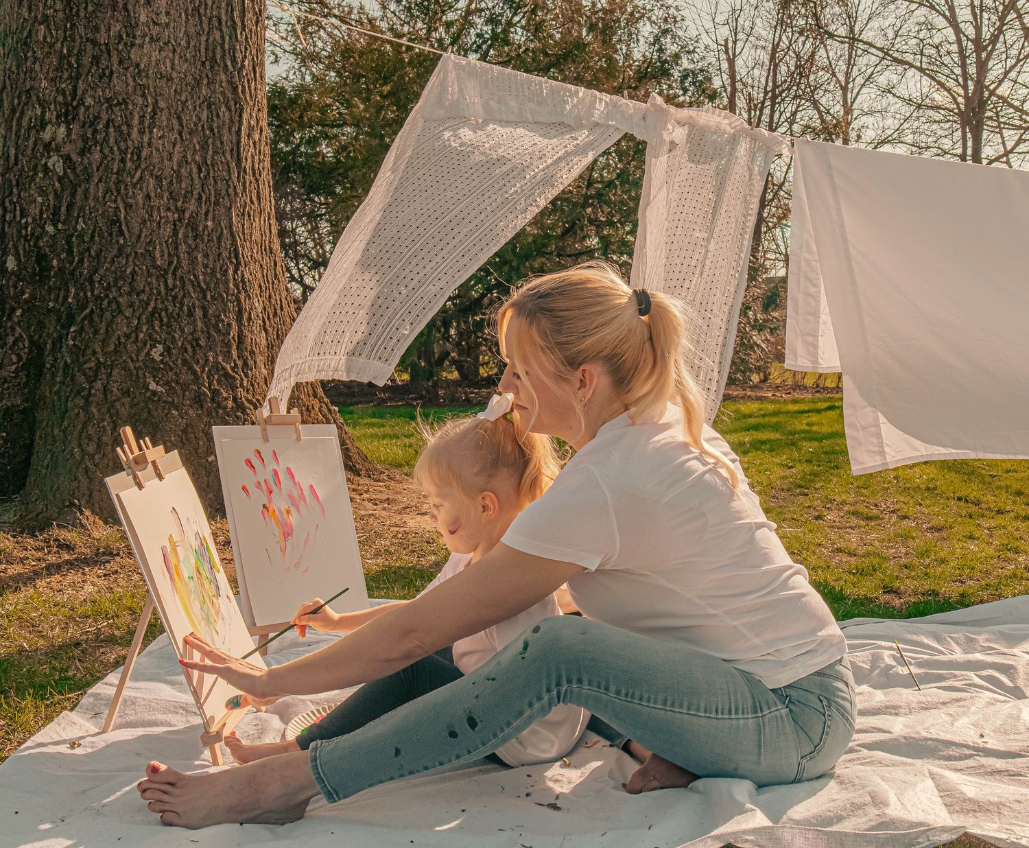 Candid family moments playing outdoors in muddy conditions.