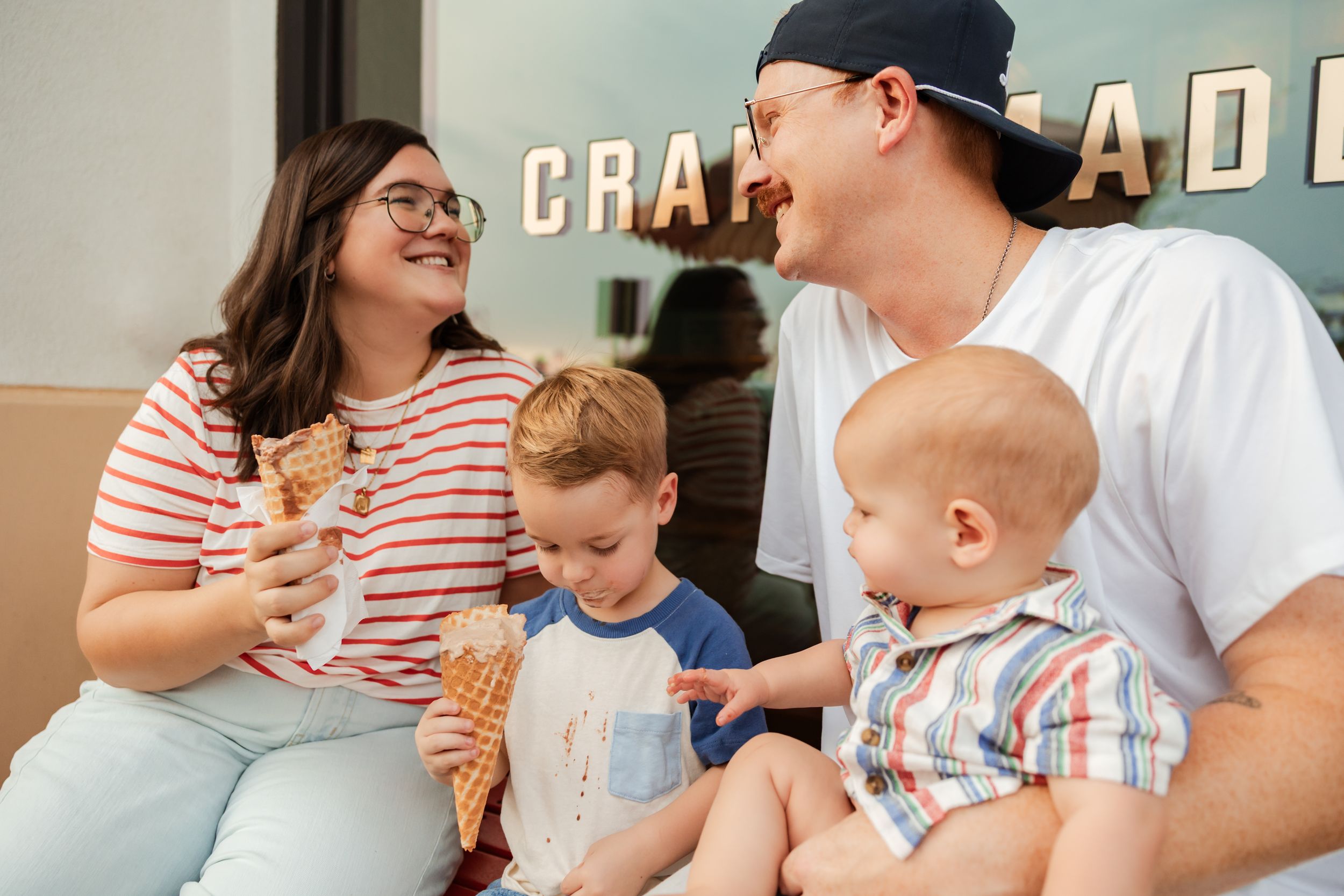 A series of photos showing a family enjoying ice cream cones together with a toddler in summertime.