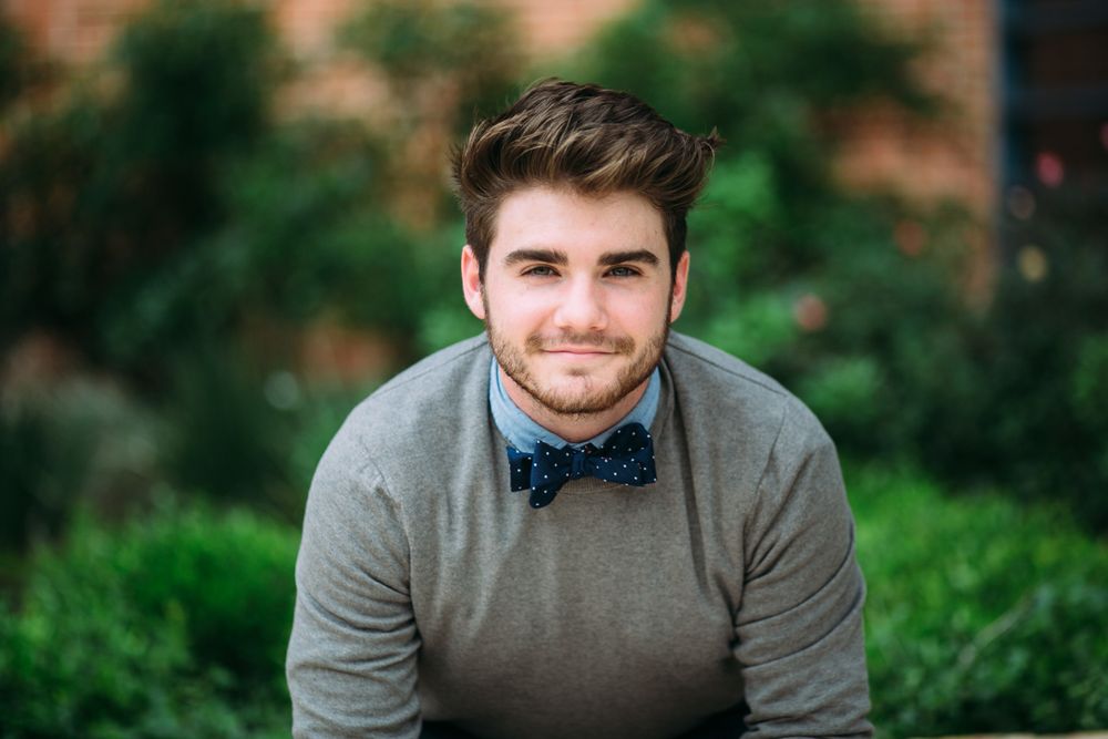 Professional headshots against dark backgrounds showcasing bowties and warm lighting.