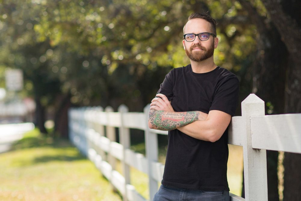 Casual outdoor portraits against white fence in natural lighting.