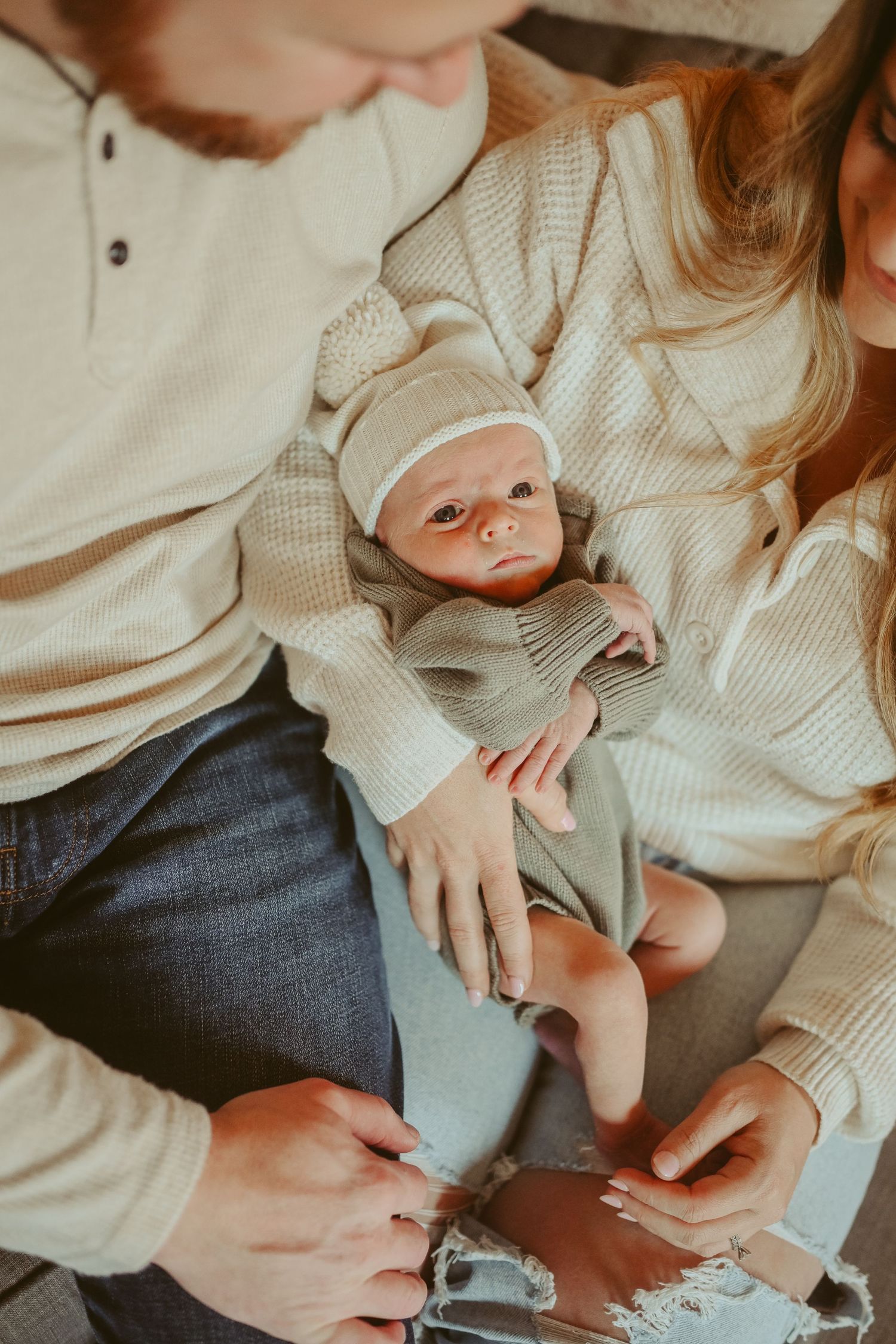 Baby boy makes eye contact with the camera during lifestyle newborn session in Clarksville, Tennessee by Disney Magic Photography