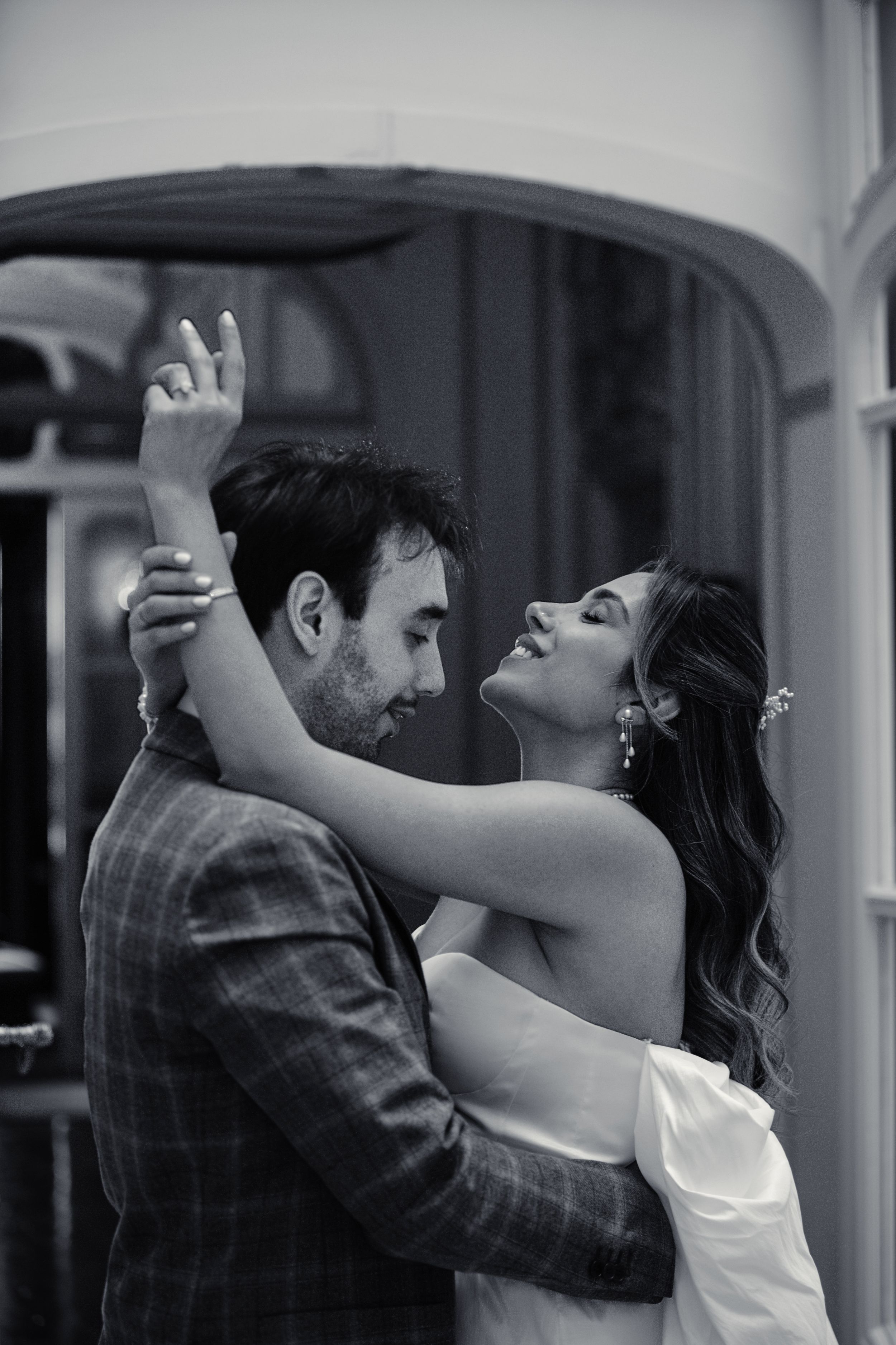 A romantic black and white photo sequence shows a couple dancing together with passionate embrace and movement.