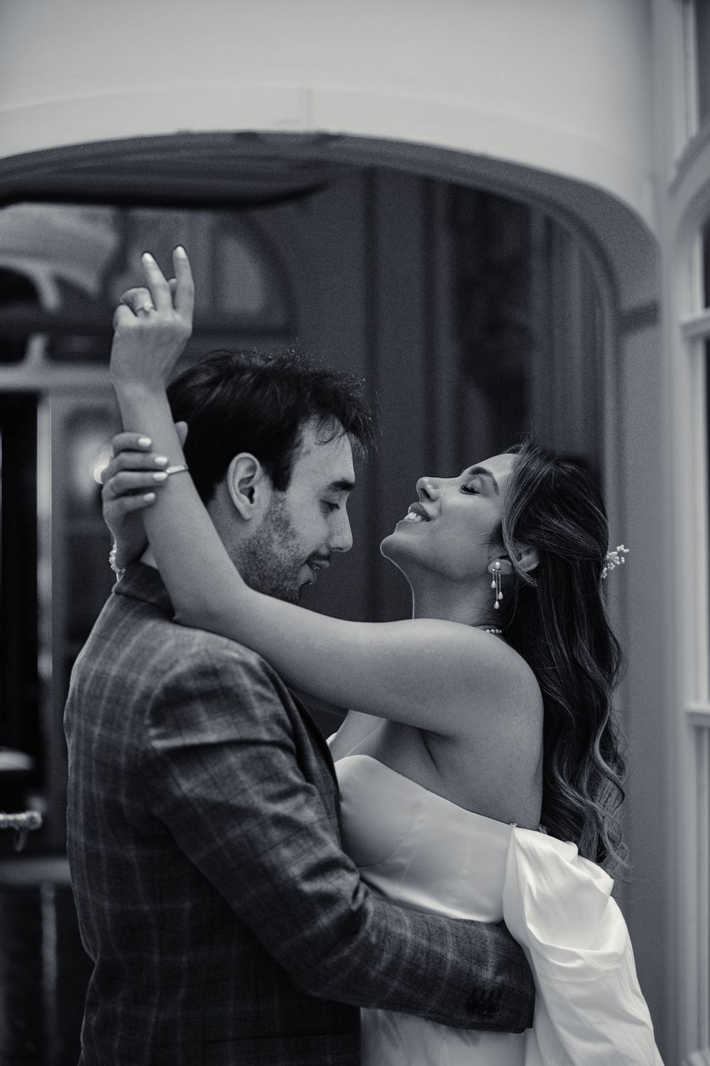 A romantic black and white photo sequence shows a couple dancing together with passionate embrace and movement.