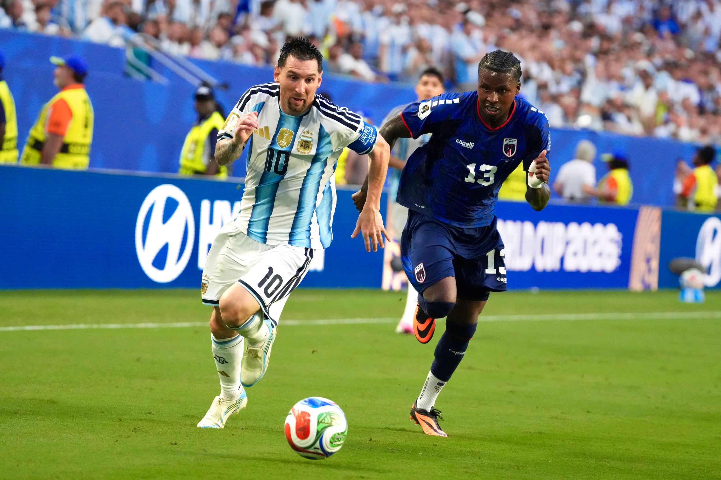 Lionel Messi in Argentina jersey dribbles past defender during Copa America 2024 match.