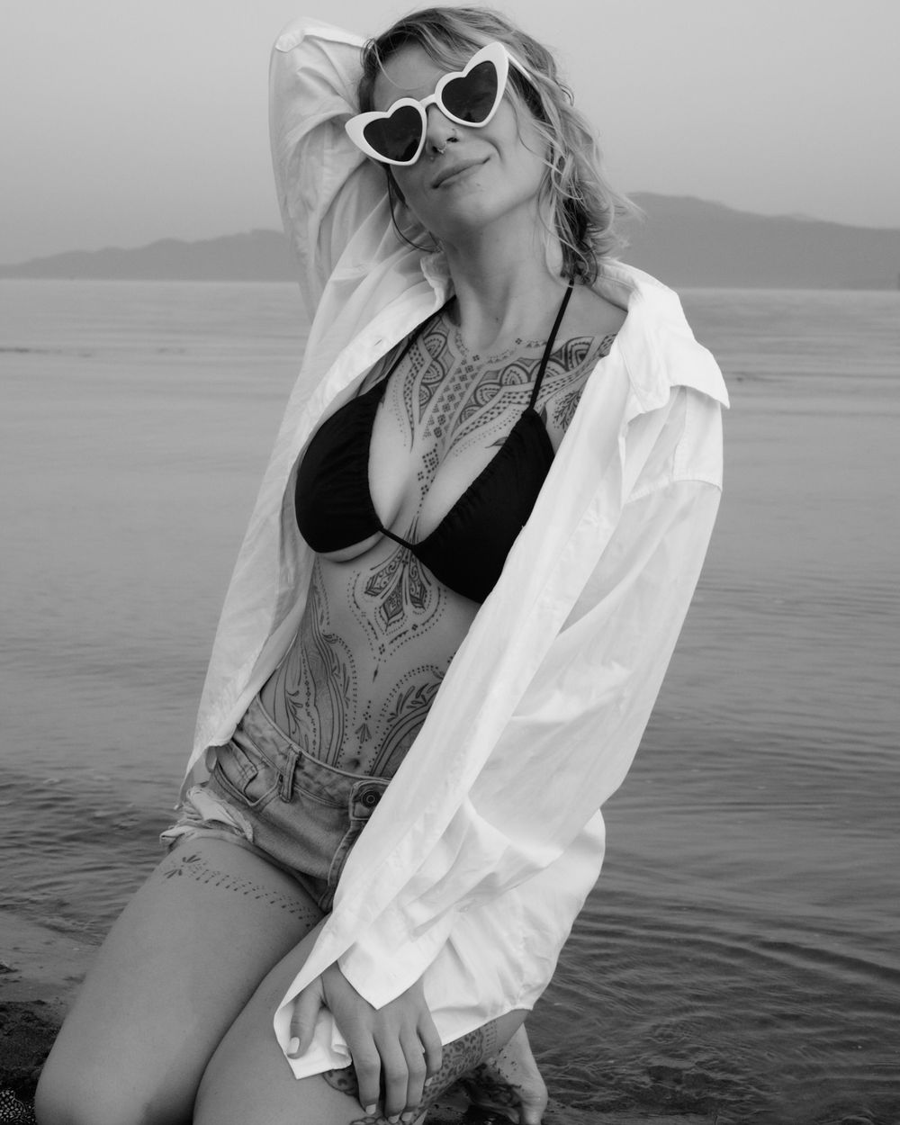 Outdoor portrait of woman in sunglasses at waterfront, North Vancouver photographer