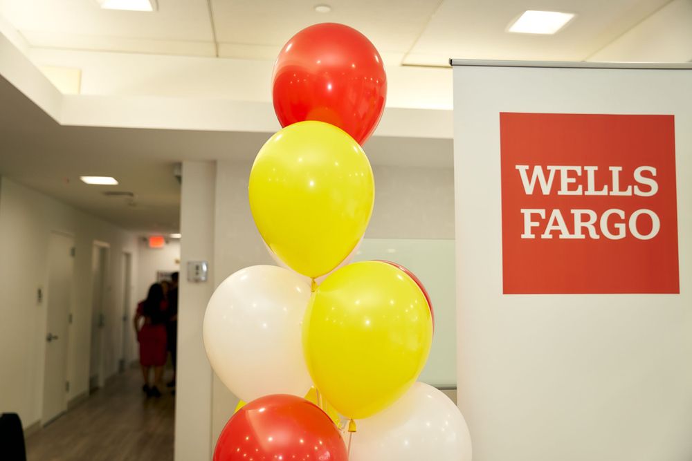 Red, yellow and white balloons decorating a Wells Fargo office hallway.