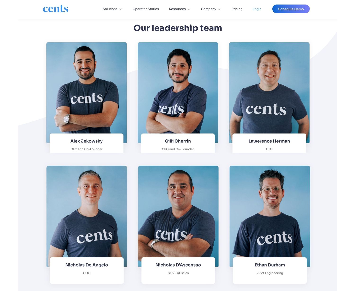 Leadership team members wearing matching company branded t-shirts in professional headshots.