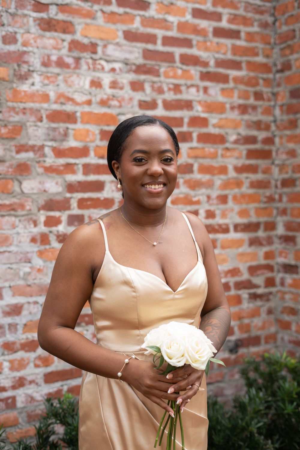 Bridesmaid beauty portrait featuring polished makeup, glowing complexion, and wedding day elegance.