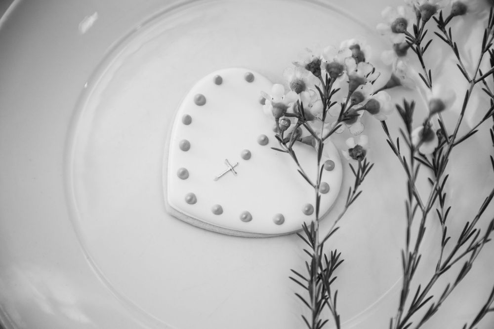 baby boy getting christened with mother holding him