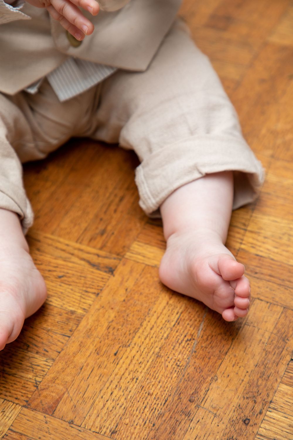baby boy getting christened with mother holding him