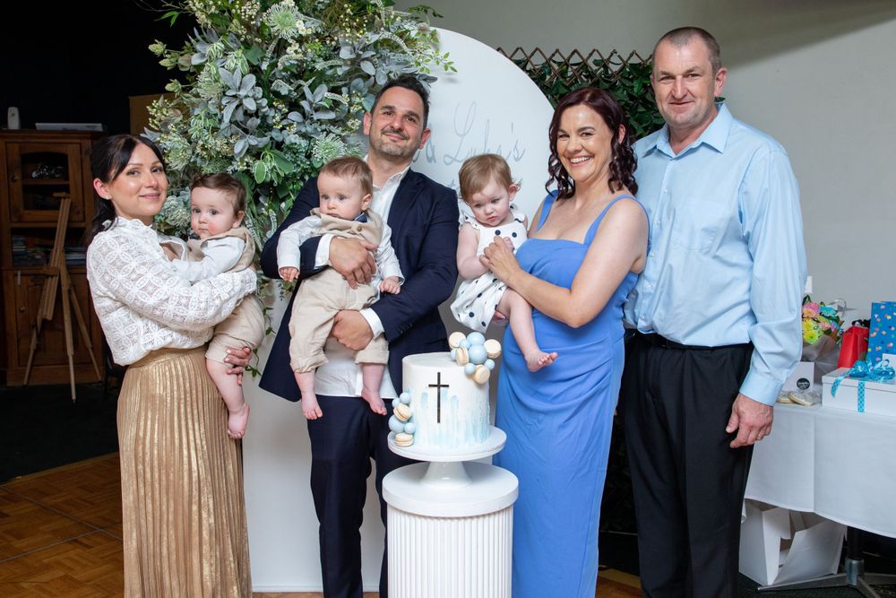 group photo of baby boys getting christened with godparents and godparents in church in Sydney
