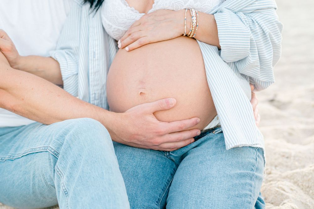 A close of a woman's bare belly at 35 weeks pregnant.