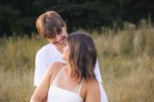 Outdoor summer golden hour engagement photos in field in Springfield, Illinois