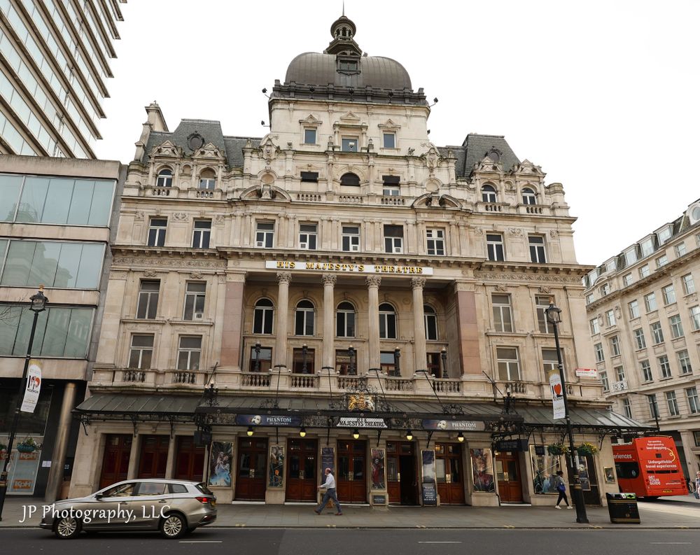 Exterior panorama of a historic Beaux-Arts style railway station building in London.