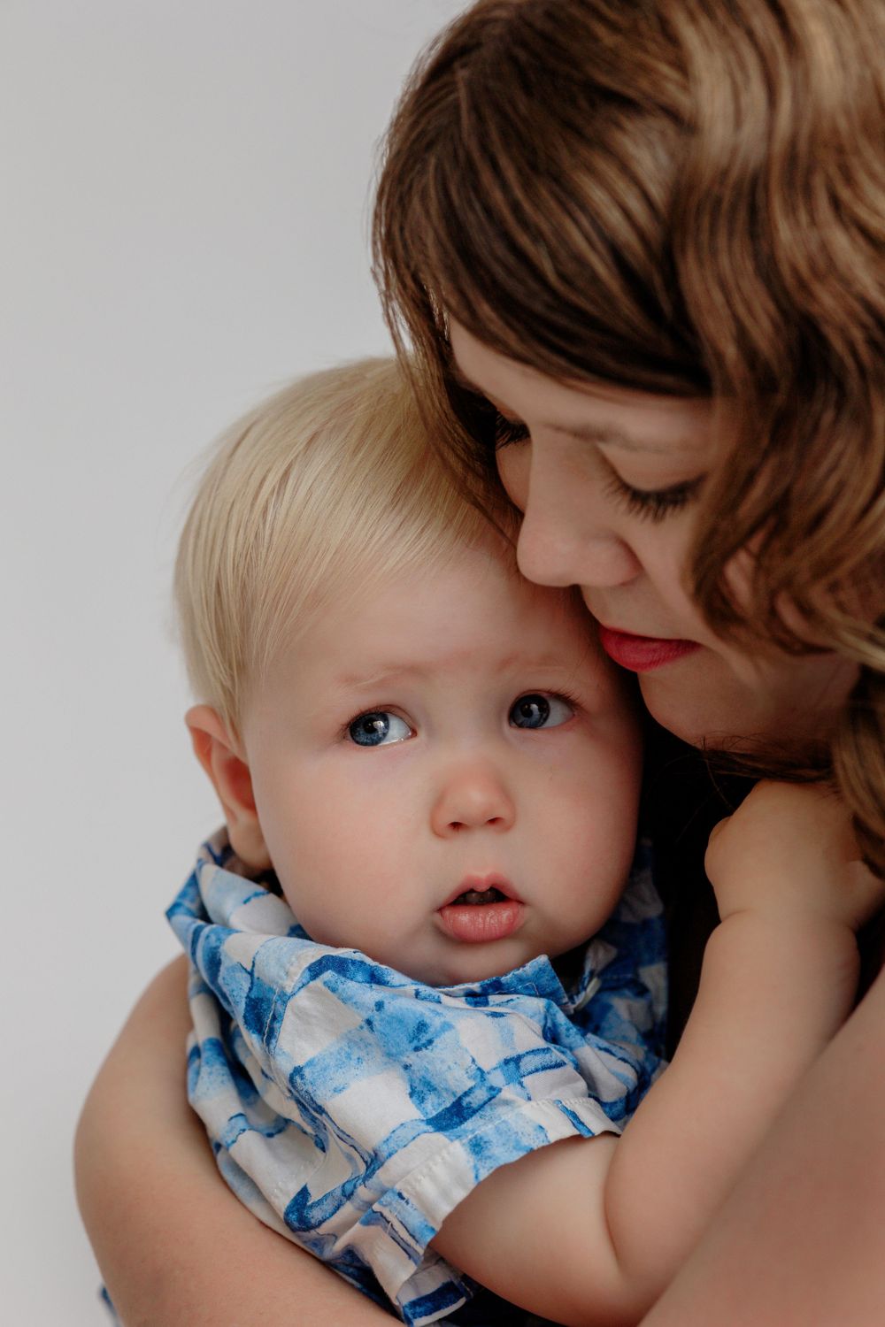 Sweet picture of a mother comforting her young toddler