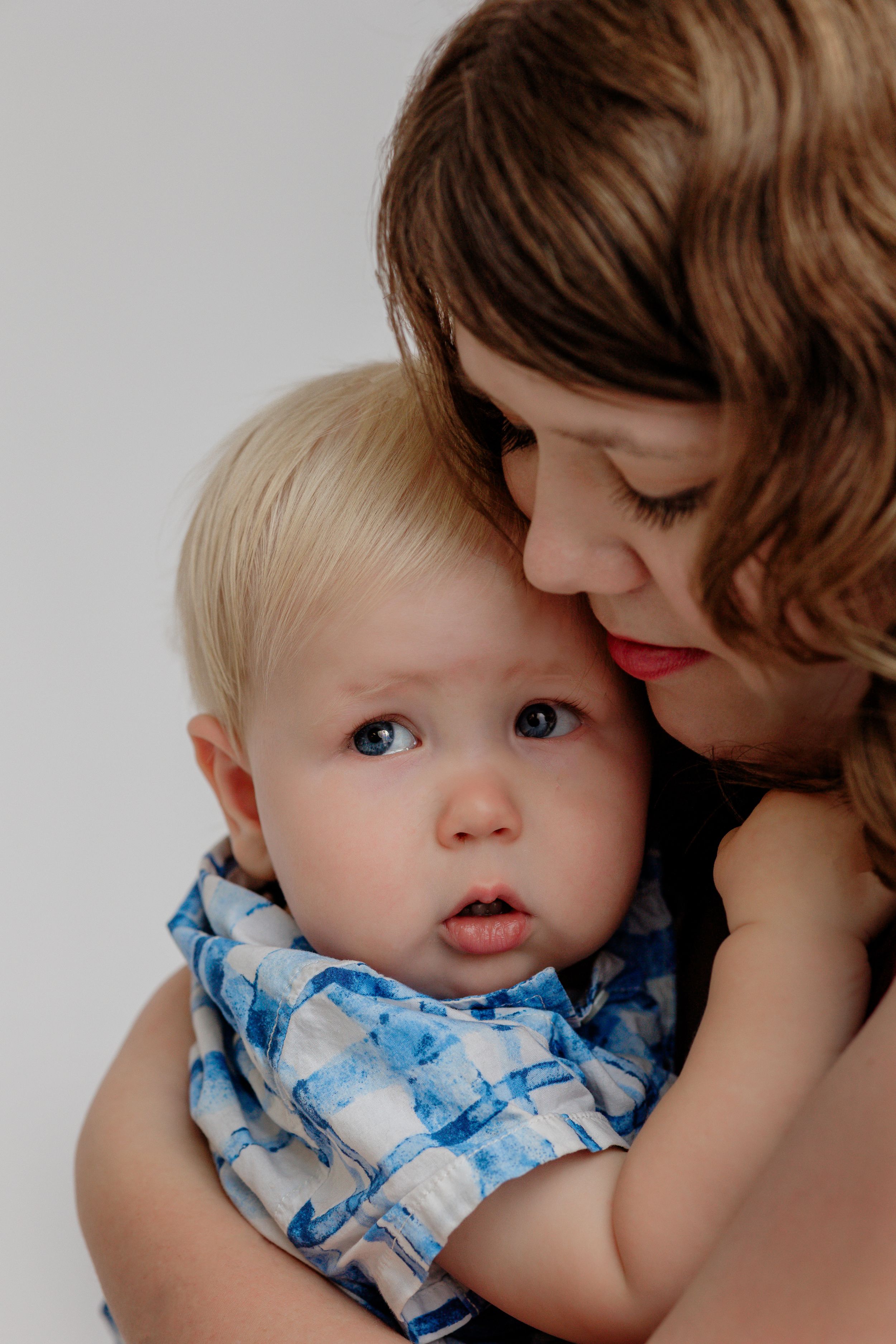 Sweet picture of a mother comforting her young toddler