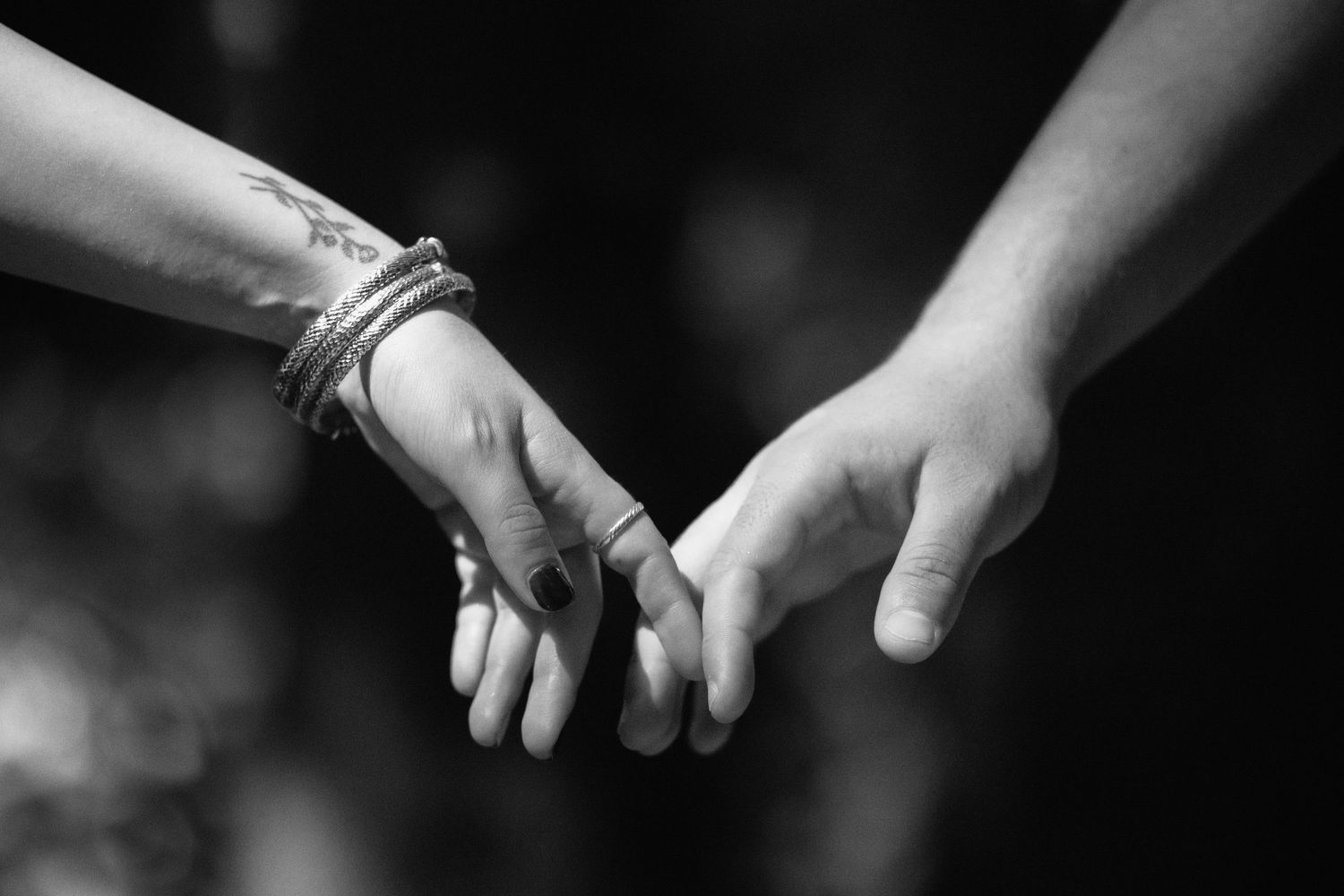 Couple holding hands at Kendall Indian Hammocks Park Miami during engagement couples session.