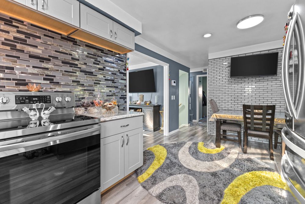 Updated kitchen with mosaic tile backsplash and stainless appliances in Dearborn Michigan
