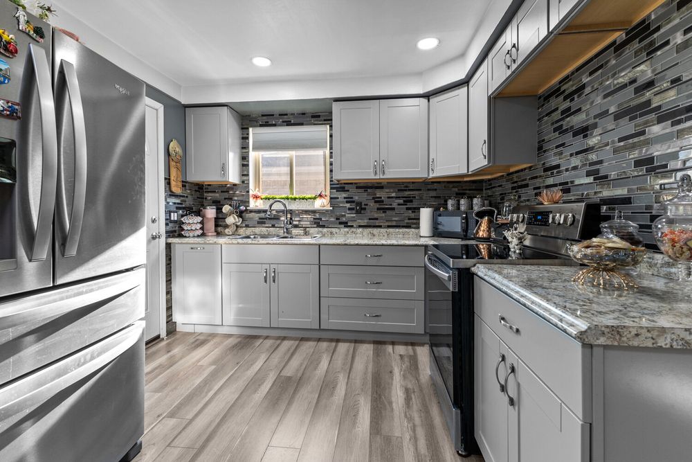 Updated kitchen with mosaic tile backsplash and stainless appliances in Dearborn Michigan