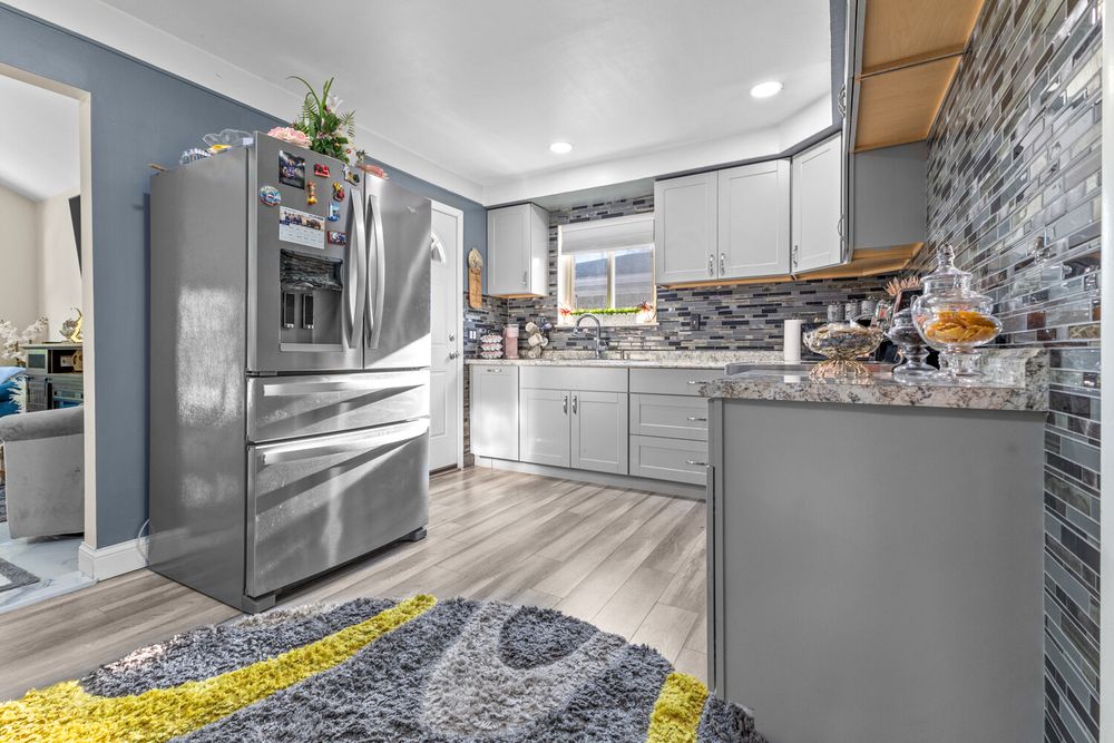 Updated kitchen with mosaic tile backsplash and stainless appliances in Dearborn Michigan