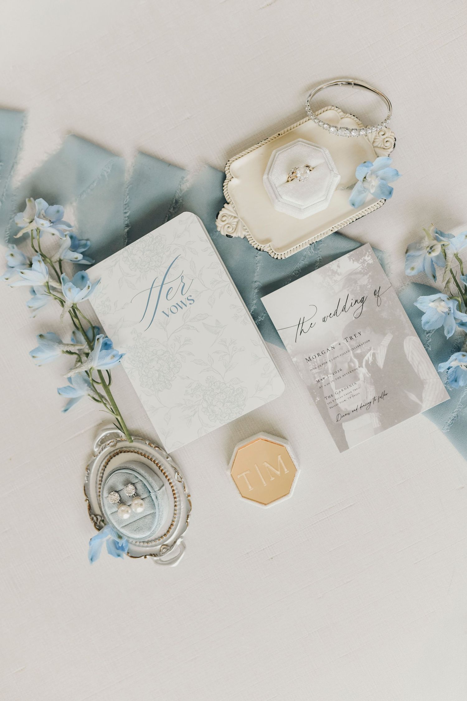 Wedding details box photographed on textured linen surface