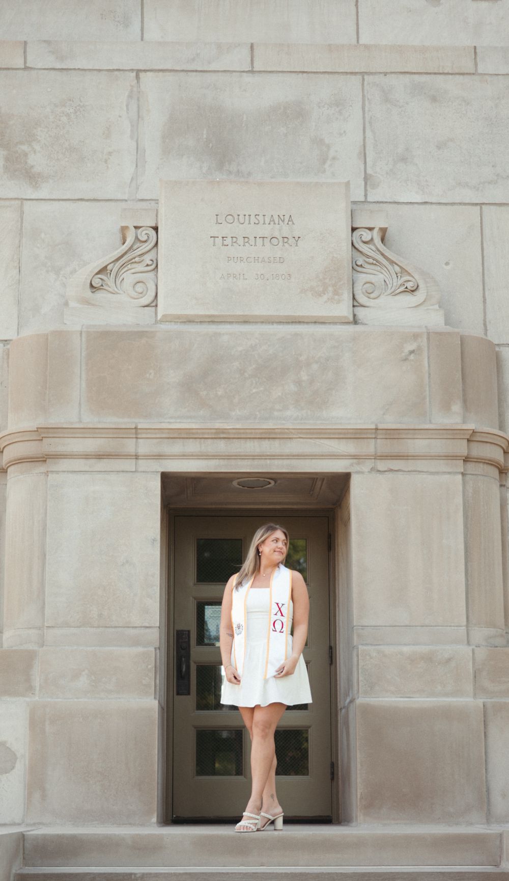 Senior girl photographed concrete with warm natural tones and a timeless edit.