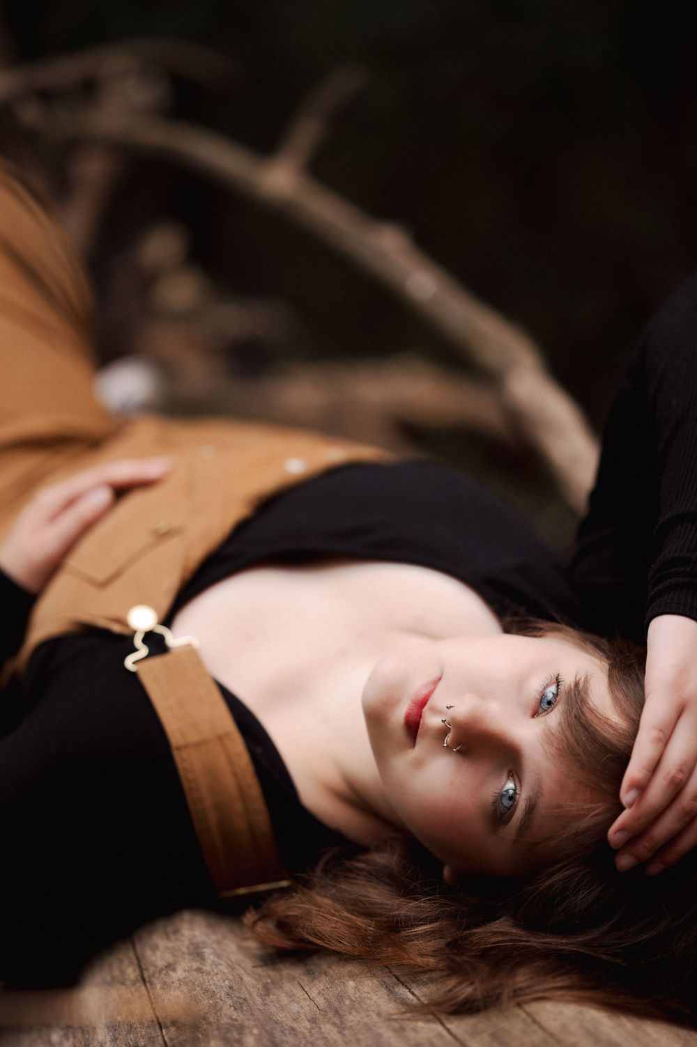 Brookings SD senior photographer capturing senior girl portraits with rich greenery, warm tones and film-inspired edits.