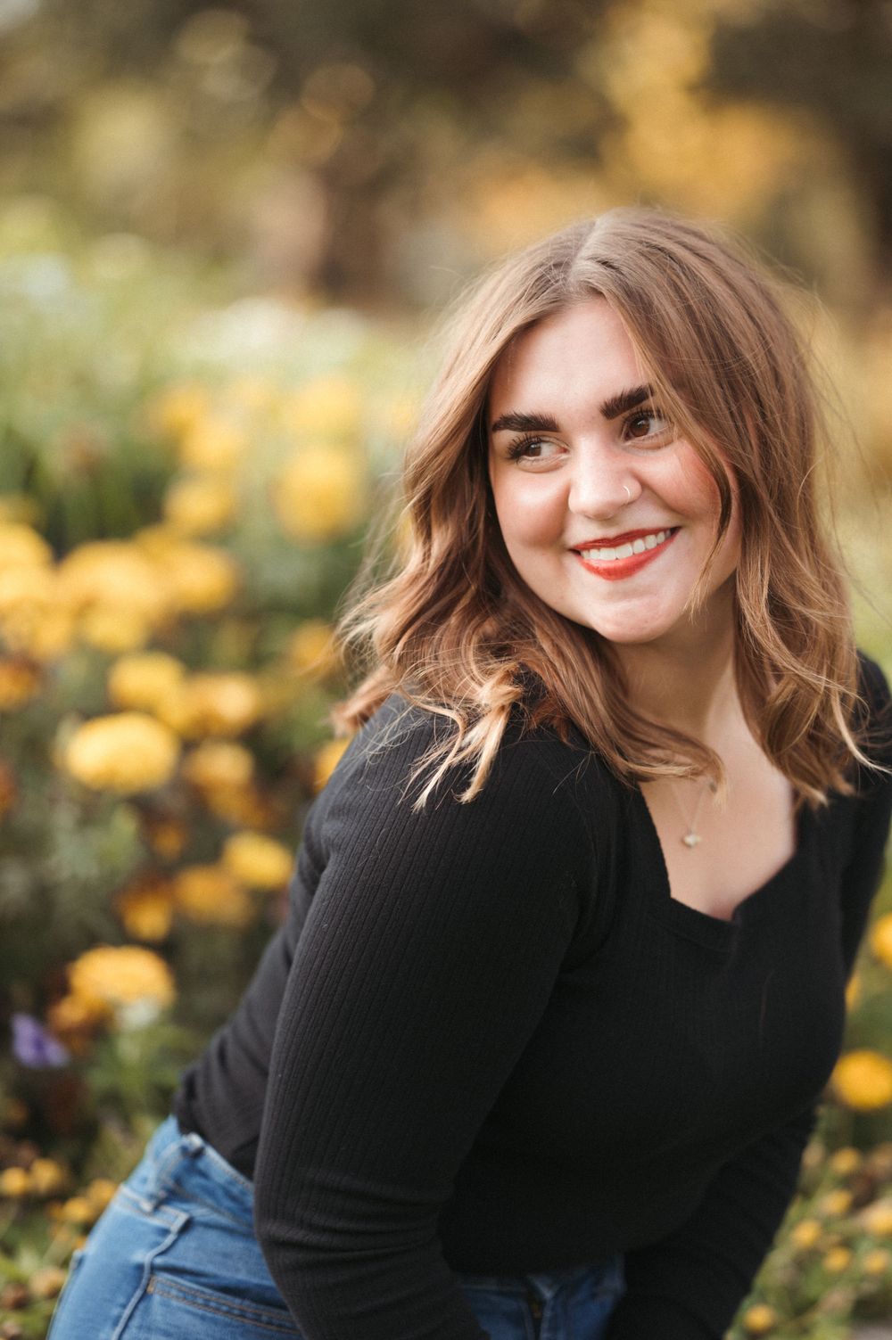Outdoor senior photos with rich greenery, subtle grain and a timeless South Dakota portrait feel.