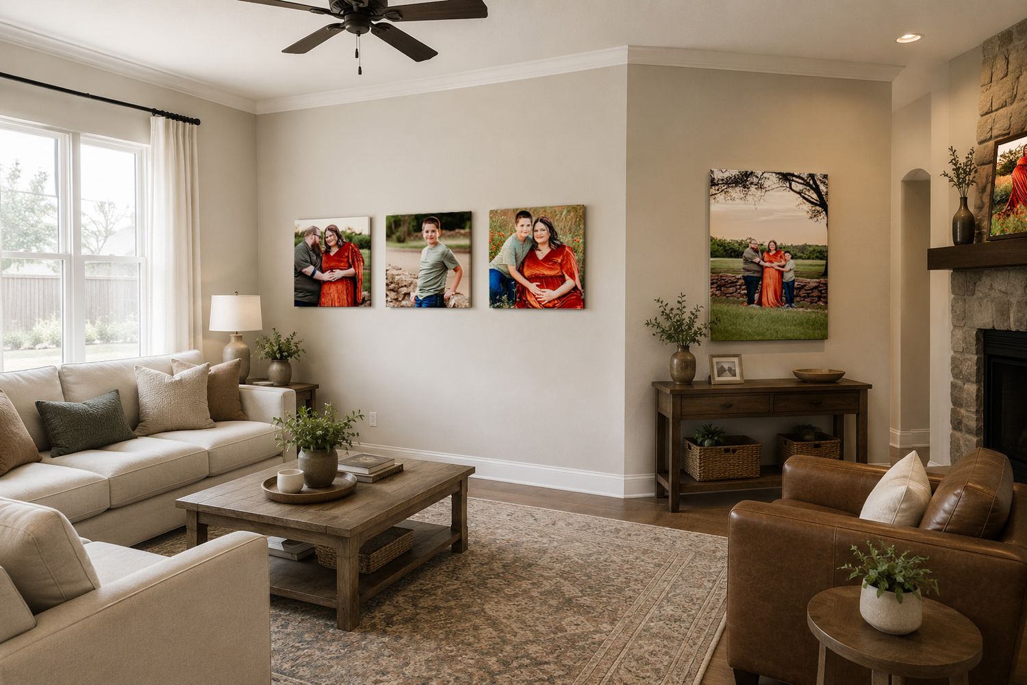 Cozy living room with beige sofas, wood coffee table, stone fireplace, and three family photo canvases on the wall.
