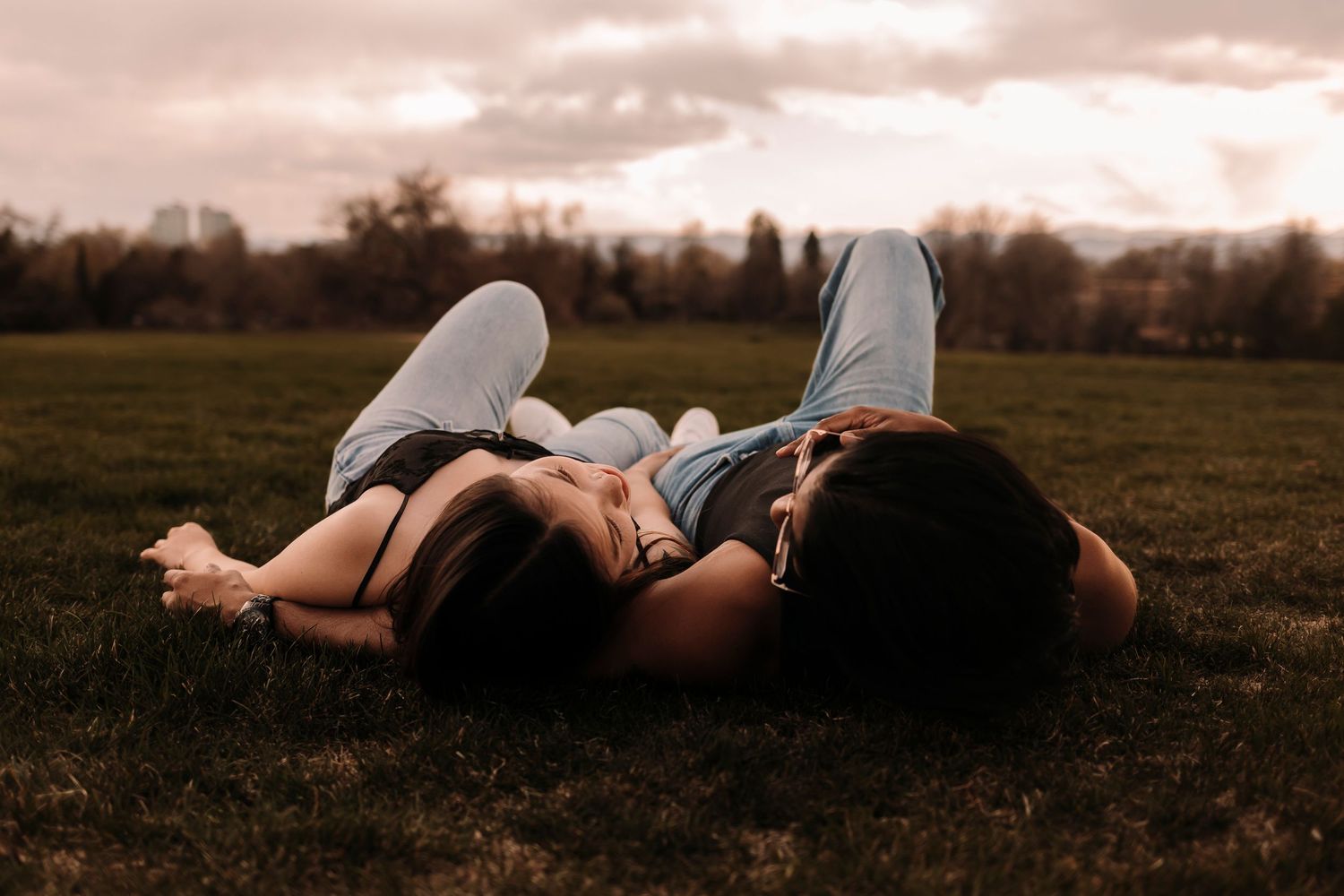 A houston couple sharing a moment while a houston photographer captures the emotion perfectly with a warm style.