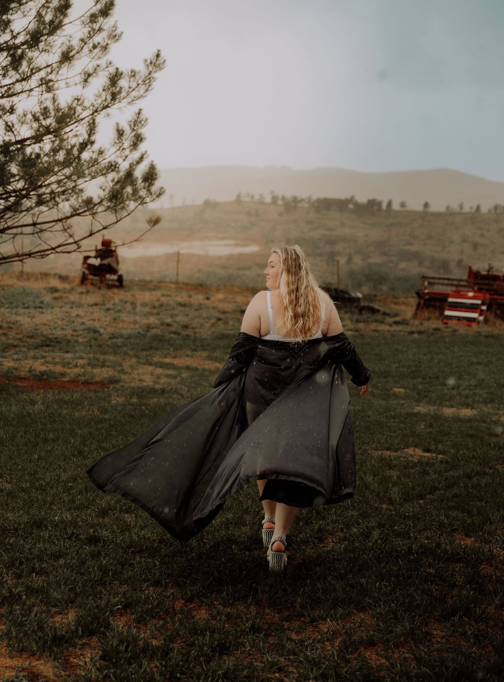 Woman walks away for dramatic, cinematic, portrait, and modeling photos in Fort Collins, Colorado