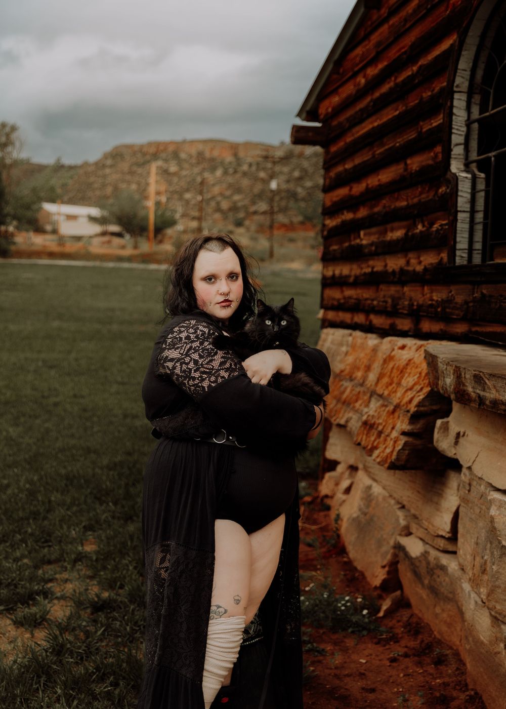 Woman poses with her cat for dramatic, cinematic, portrait, and modeling photos in Fort Collins, Colorado