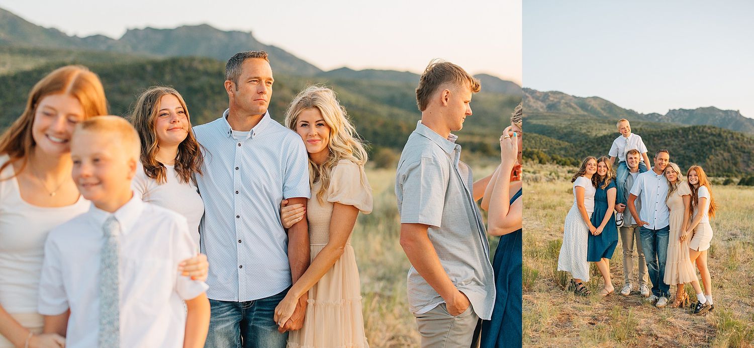 Family portrait session in a golden field with mountain backdrop, featuring smiling parents and children in coordinating neutral outfits.