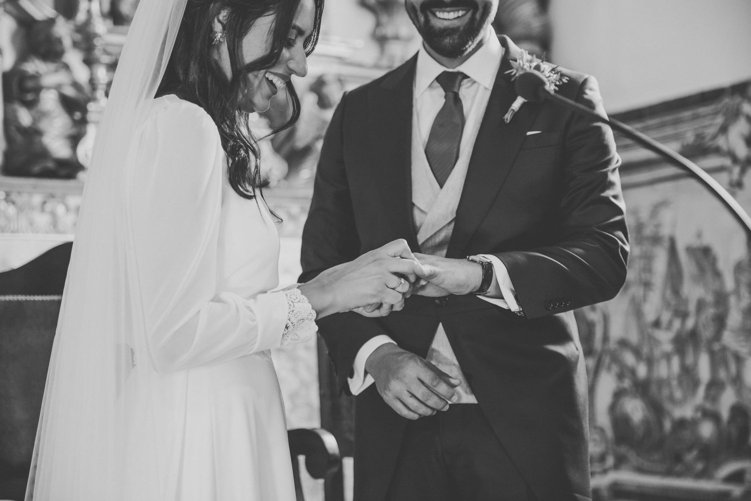 Black and white candid wedding moments showing joyful interactions between a couple.