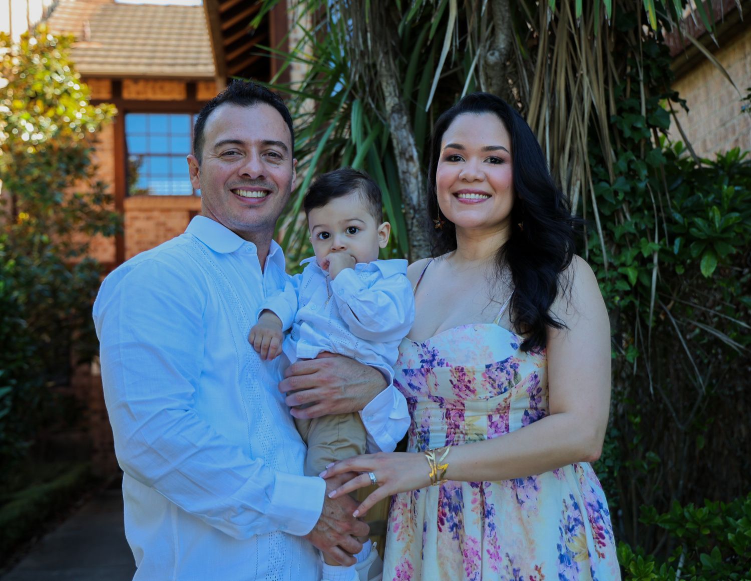 Two parents holding their baby