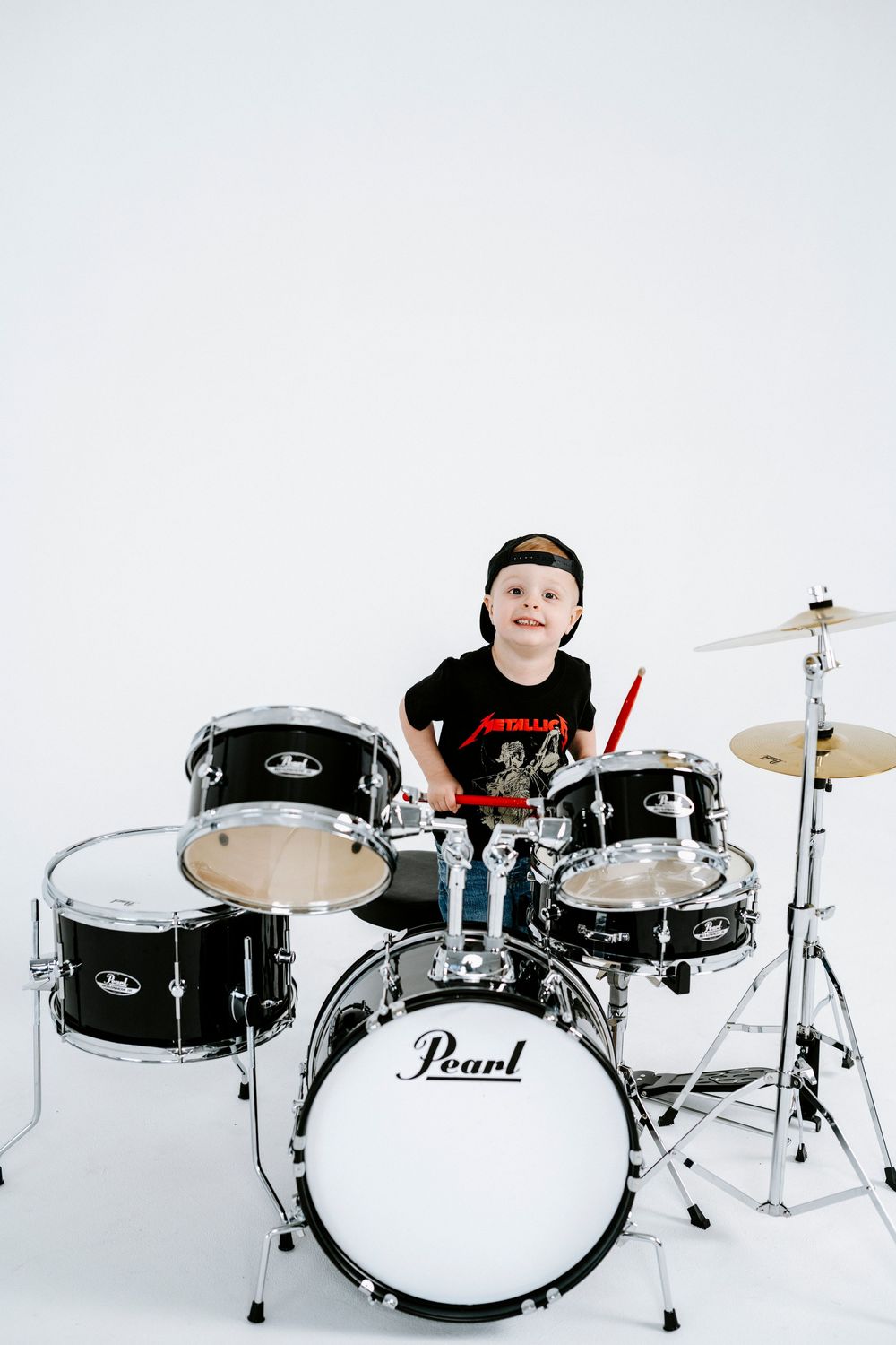 Black Pearl drum kit photographed in sequence showing different angles against white background.