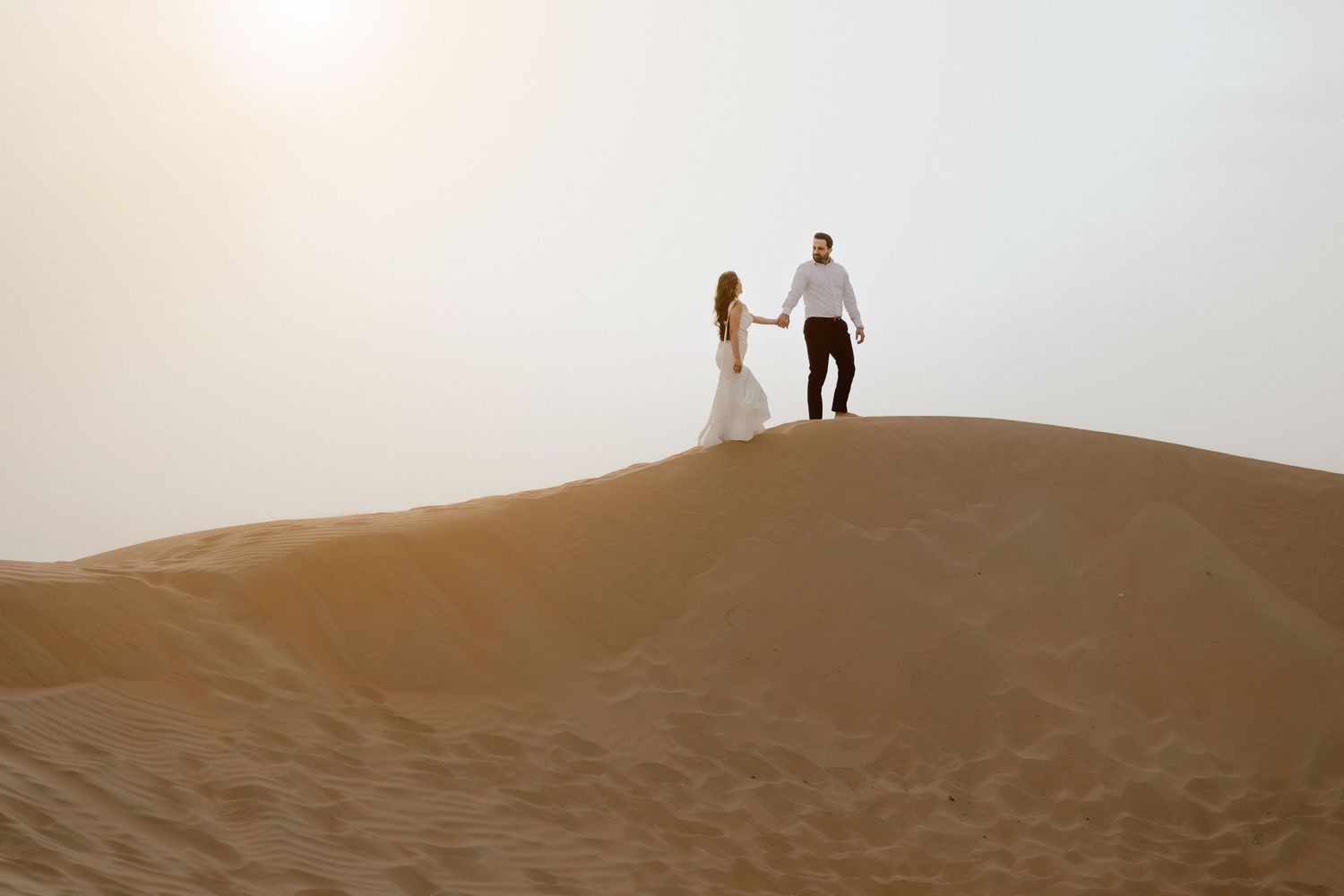Sunset couple photoshoot in Dubai with romantic silhouette on the beach
